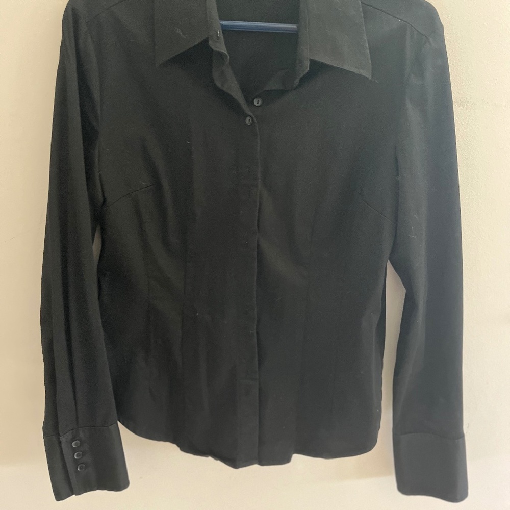 Black button-up blouse by Tristan